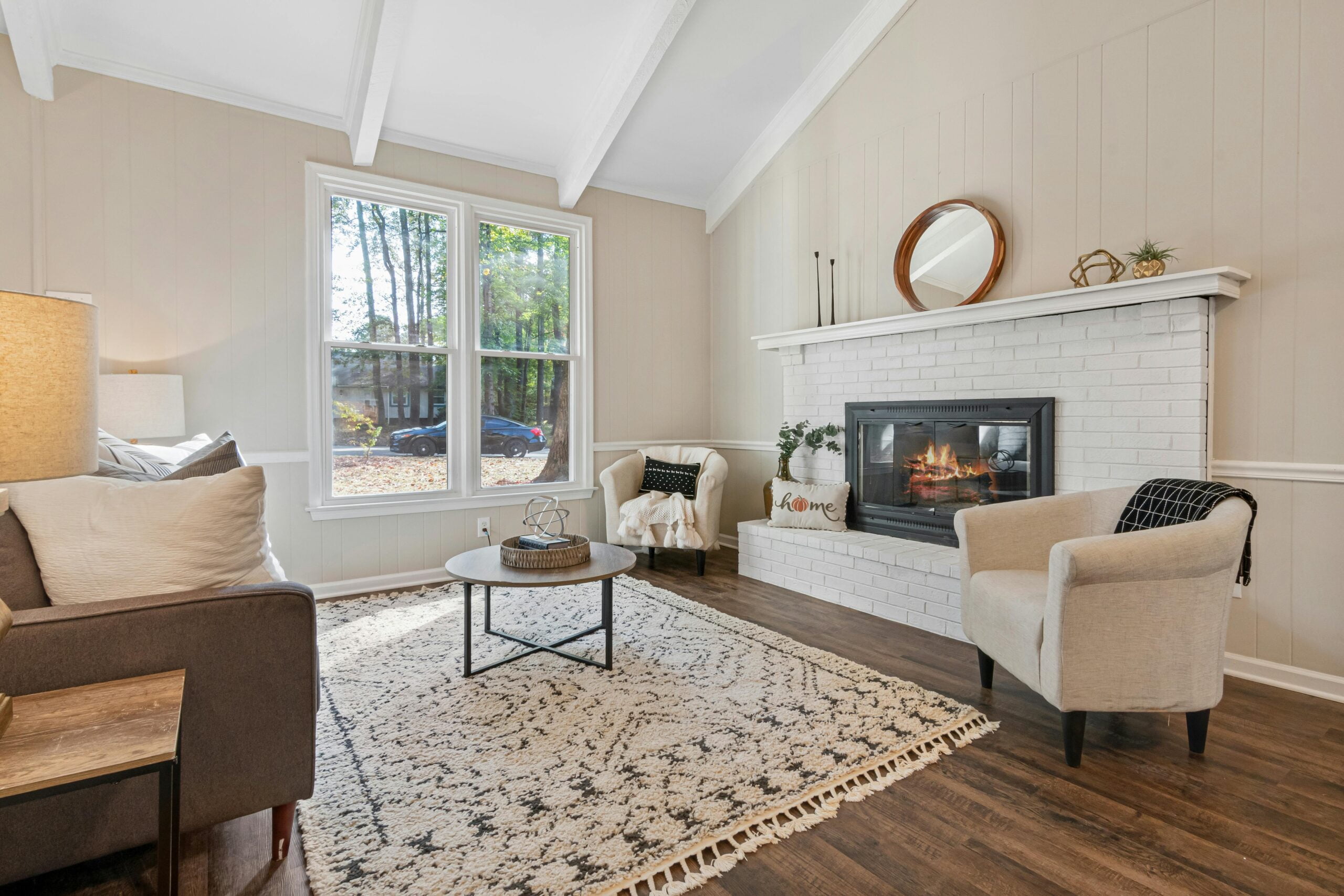 This image clearly compares Carpet vs Hardwood in a bedroom by showing soft carpet on one side and sleek wood flooring on the other to illustrate comfort differences in Carpet vs Hardwood.