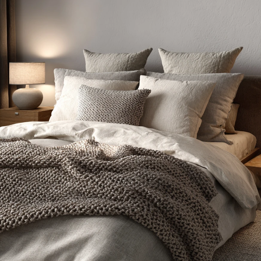 Sustainable cozy bedding made from organic cotton and bamboo fabrics, neatly folded for care
