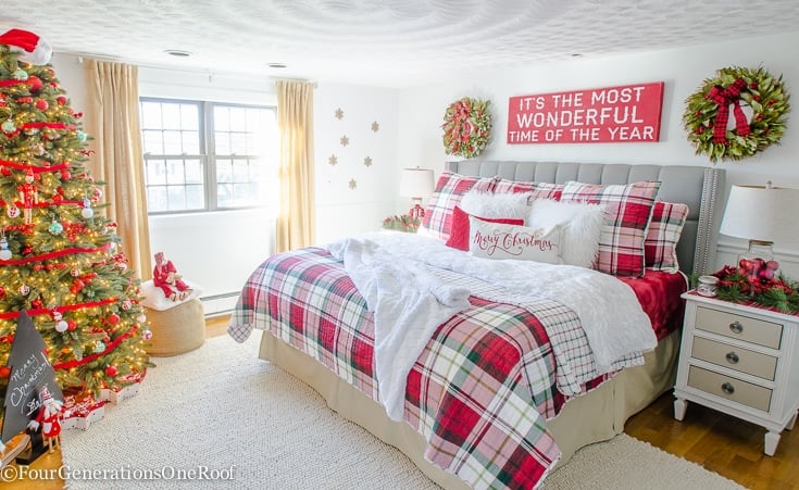 Neutral cozy Christmas bedroom with plaid bedding, warm string lights, featuring christmas bedroom aesthetic holidays