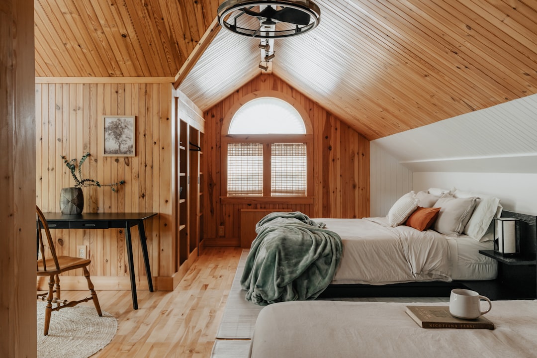 This picture demonstrates care and maintain bedroom carpets tips by showing trimming a small carpet snag instead of pulling it.