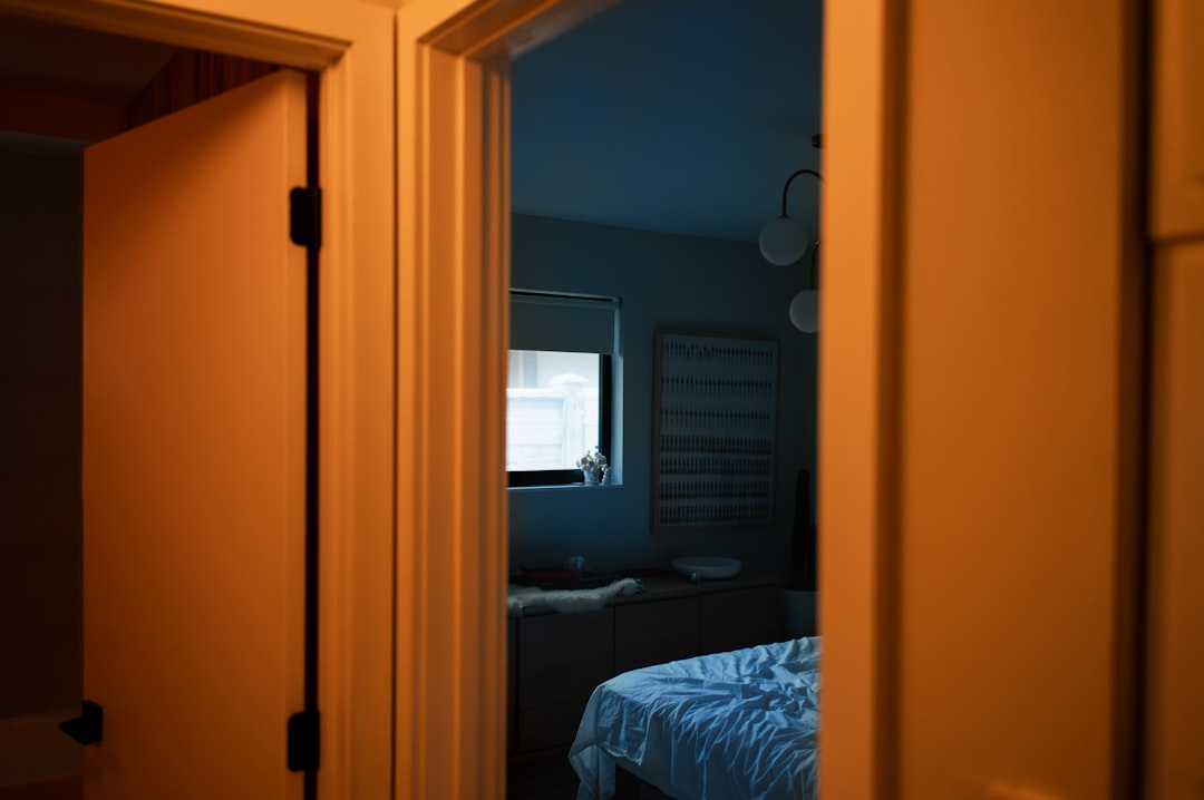 sanding smooth edges of a DIY bed frame before staining