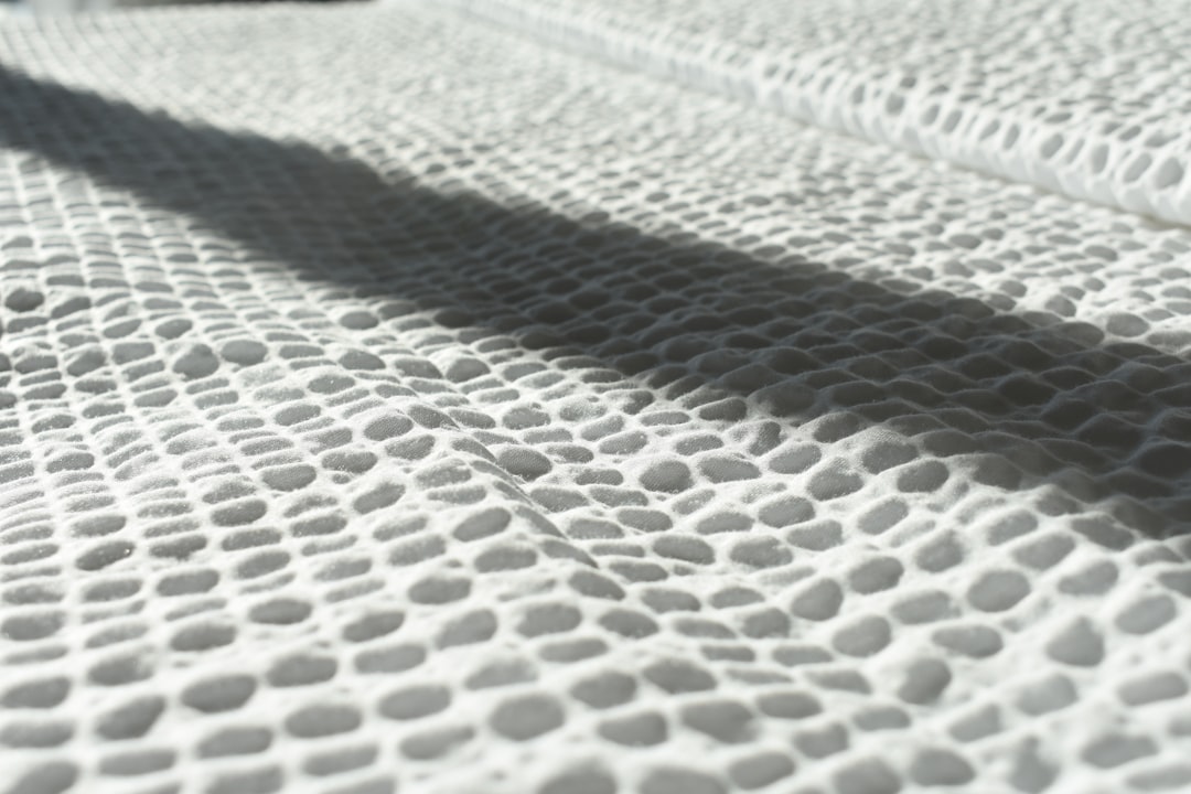 Memory foam mattress cross-section showing deep contouring and body-hu featuring hybrid memory foam
