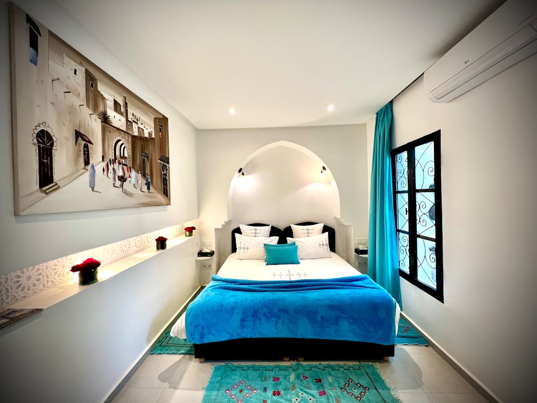 This image features reclaimed boards and pallets repurposed into a sturdy DIY bed frame to save money and reduce waste.