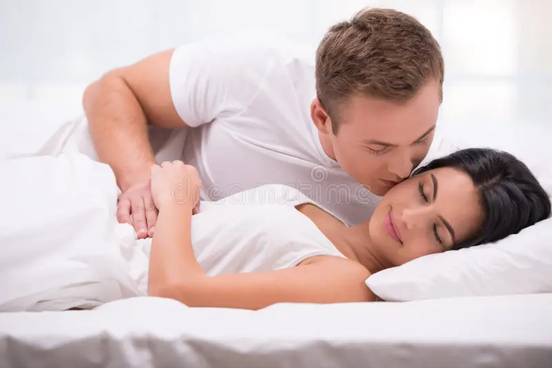Happy couple enjoying peaceful sleep together – one of the best mattre featuring mattresses couples toss turn