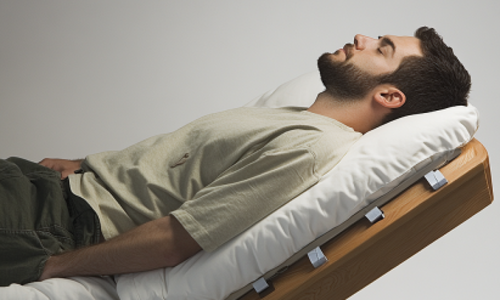 "Side view of a bed elevated by six inches, demonstrating Inclined Bed Therapy and sleep apnea management for better airflow and sleep quality."